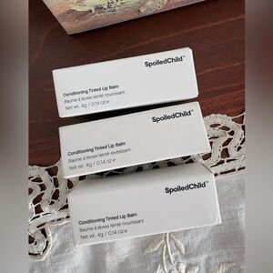 Spoiled Child Conditioning Tinted Lip Balms in Plum and Natural Pink